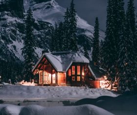 Brightly lit houses on winter night Stock Photo