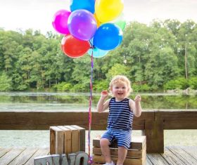 Child who see balloons happy Stock Photo