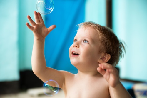Children catching bubble Stock Photo