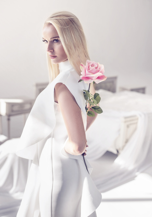 Elegant young blonde holding a beautiful pink rose Stock Photo 01