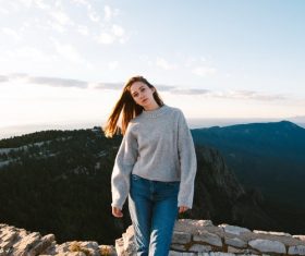 Girl taking pictures on the mountain Stock Photo