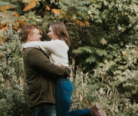 Happy hugging couple outdoors Stock Photo