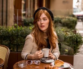 Lovely woman at roadside cafe Stock Photo