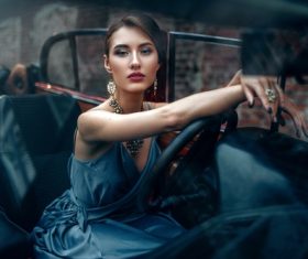 Make-up woman sitting in the car Stock Photo