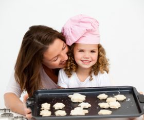 Mother and daughter making cookies together Stock Photo 10