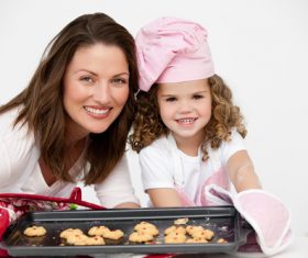 Mother and daughter making cookies together Stock Photo 11
