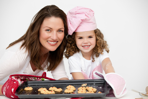 Mother and daughter making cookies together Stock Photo 11