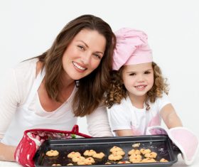 Mother and daughter making cookies together Stock Photo 12