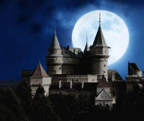 Night castle and the moon in the sky Stock Photo