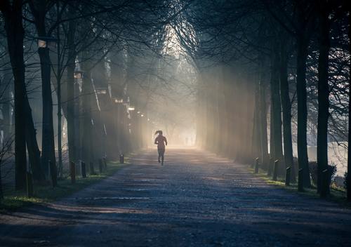 People jogging in the mist morning Stock Photo
