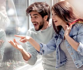 Portrait of a couple with shopping bags in city Stock Photo 03
