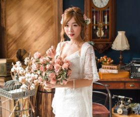 Retro girl holding bouquet Stock Photo