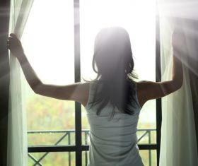 Stock Photo Woman opens the curtain 02