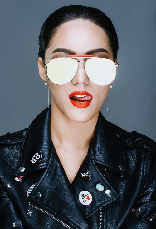 With sunglasses wearing a black leather jacket handsome woman Stock Photo