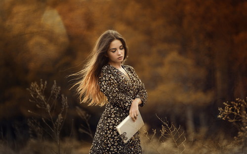 A Woman in Black Cardigan Posing in the Grassfield · Free Stock Photo