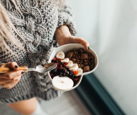 Woman in Knitted Sweater Enjoying Morning Breakfast Stock Photo