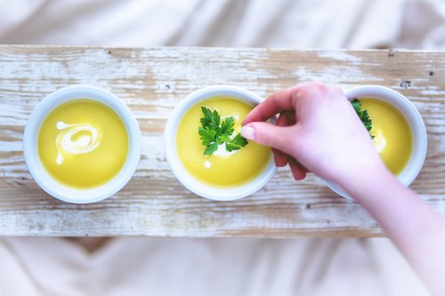 leek and potato soup hand Stock Photo