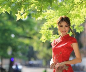 Asian girl wearing red cheongsam smiling Stock Photo