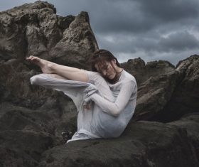 Asian woman posing on the reef Stock Photo
