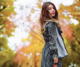 Beautiful Asian girl on the street in autumn outdoor Stock Photo