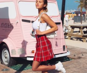 Beautiful girl in white tops and red checkered skirt Stock Photo