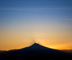 Beautiful sunset over the top of the mountain Stock Photo