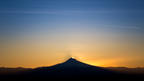 Beautiful sunset over the top of the mountain Stock Photo