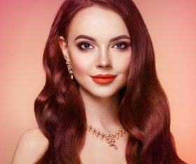 Beautiful woman face makeup artist applies eyeshadow Stock Photo