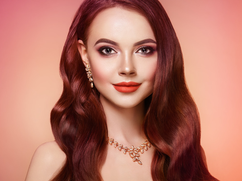 Beautiful woman face makeup artist applies eyeshadow Stock Photo