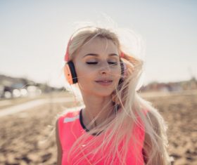 Beautiful woman listening to music Stock Photo 01