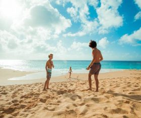 Children play on the beach by the sea Stock Photo