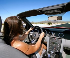 Female driver concentrating on driving Stock Photo