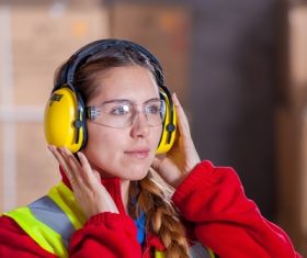 Female shooter wearing ear protectors Stock Photo