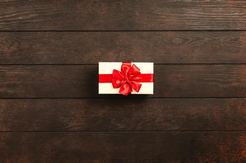 Gift box close-up on wooden table Stock Photo