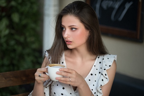 Girl looking at the distance with coffee Stock Photo