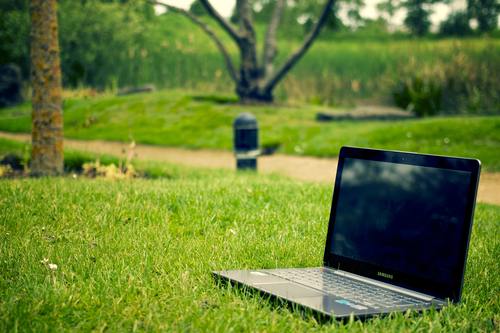 Laptop on the lawn Stock Photo