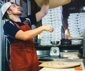 Male chef making pizza Stock Photo