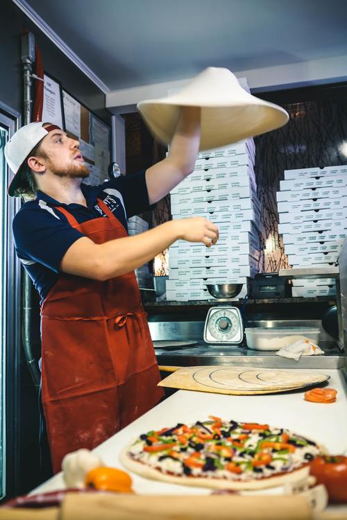 Male chef making pizza Stock Photo