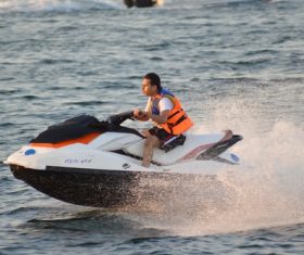 Man driving water scooter Stock Photo