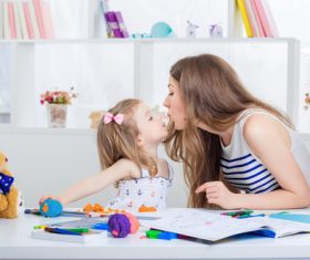 Mom and daughter interact closely Stock Photo