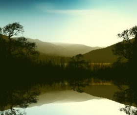 Mountains and trees at dawn Stock Photo