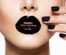 Painted black nail polish lipstick female models Stock Photo