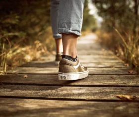 Partial photography of people on boardwalk Stock Photo