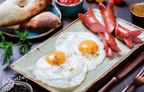 Sausage and fried egg Stock Photo