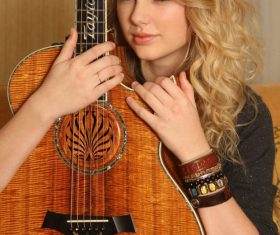 Stock Photo Blonde singer with guitar