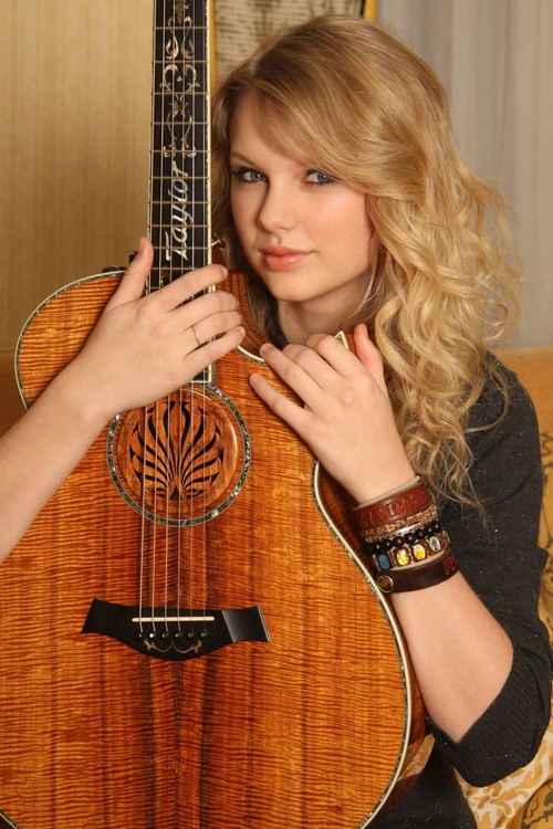 Stock Photo Blonde singer with guitar