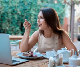 Stock Photo Woman eating cake