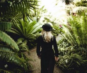 Stock Photo Woman walking on the garden ramp
