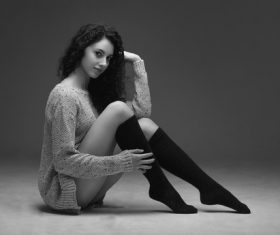 Stock Photo Woman wearing knit sweater and high knee socks
