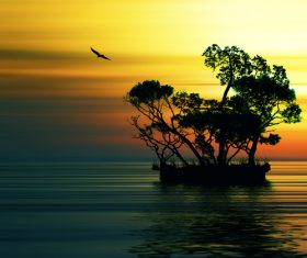 Sunset afterglow flying birds and small islands in the sea Stock Photo